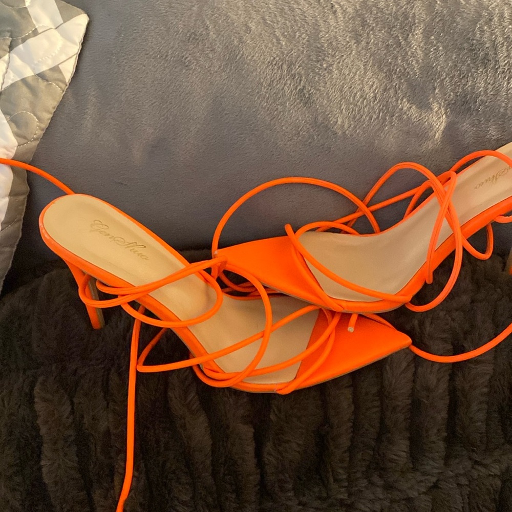 Orange size 8.5 women’s stiletto heels.